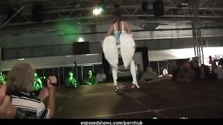 Hot brunette learns to striptease on the pole