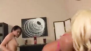 Lesbians in skirts fuck each other with toys on the bed, creating a steamy scene that’s sure to heat up your screen