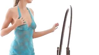 A girl is doing erotic moves in front of the mirror to excite you