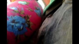 A man caresses a riser through the pants on the bus