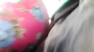 A man caresses a riser through the pants on the bus