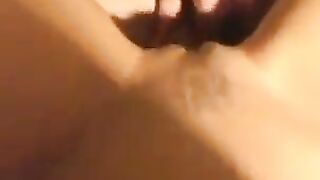 A beautiful woman has sex with her young boyfriend in a close-up scene
