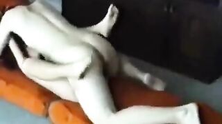 A young couple has sex at home, exploring each other with passion and intensity