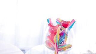 A girl has fun with a vibrator, latex and shaved pussy in captivating shots