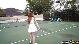 The girl is having fun with her coach on the tennis court