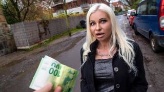 A blonde MILF is fucking on the street for money