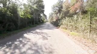 A sexy girl in the form of an Amazon rides a guy outdoors