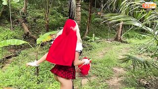 A little girl in a red riding hood costume knows the business very well