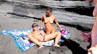 A girl undresses on the beach and rubs herself, exciting a guy