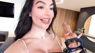 A girl is having fun with her best friend using a strap-on dildo