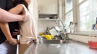 A sexy brunette with big tits fucks her husband in the kitchen