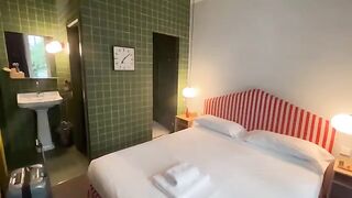 A girl caresses herself in the shower, thinking about her travels