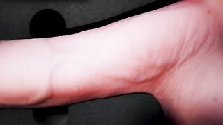 A girl caresses herself with a dildo, achieving intense pleasure