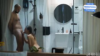 A couple enjoys intimacy in the shower stall, despite its tight space