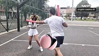 A girl is having fun with her personal trainer in the gym