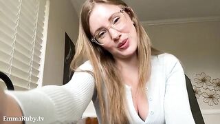 A girl with glasses paints her lips with lipstick in HD
