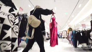 A girl almost got caught while giving a blowjob in the fitting room