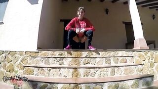 A sexy girl urinates in the street, showcasing Megan Rain’s daring side